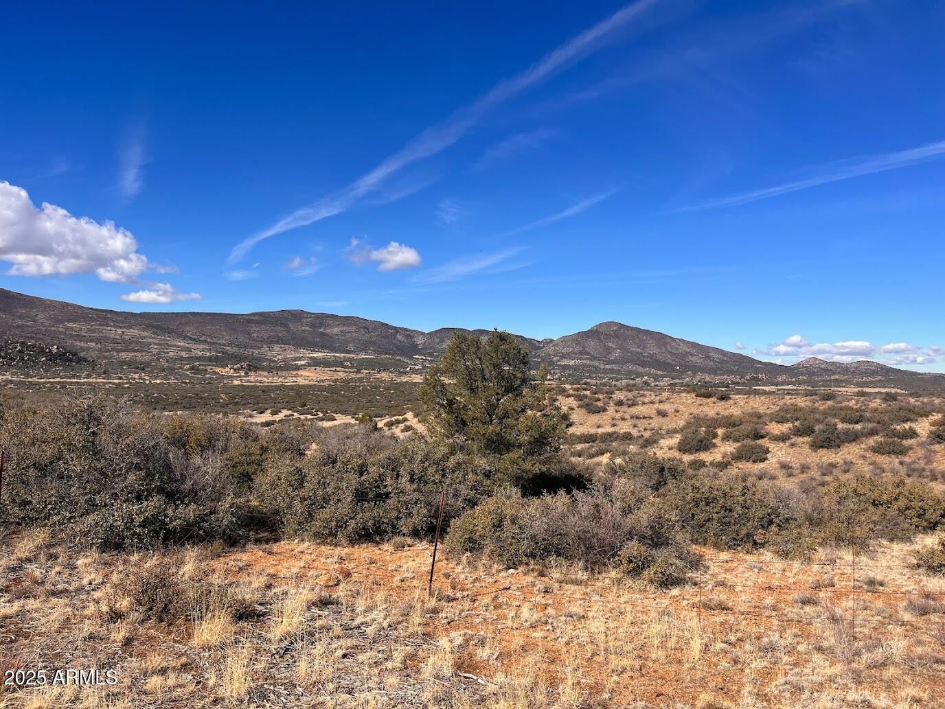 1100 South Iron Springs Road Skull Valley, AZ 86338 - Photo 3 of 6 a view of a large building with a mountain in the background