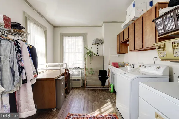 a front view of a house with a yard covered in snow
