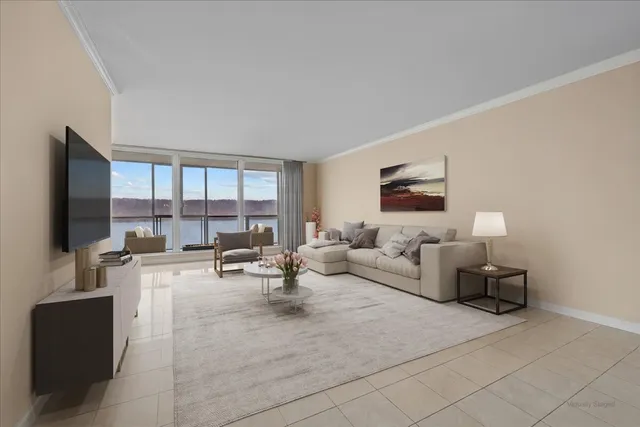 a living room with furniture and large flat screen tv