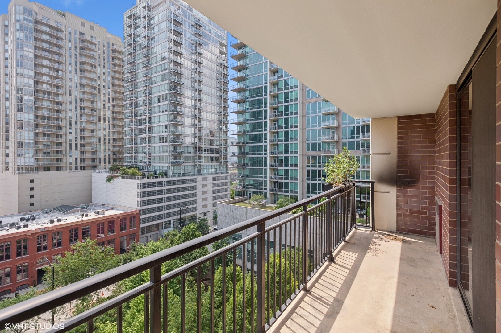 451 West Huron Street, Unit 910 Chicago, IL 60654 - Photo 11 of 27 a view of balcony with wooden floor