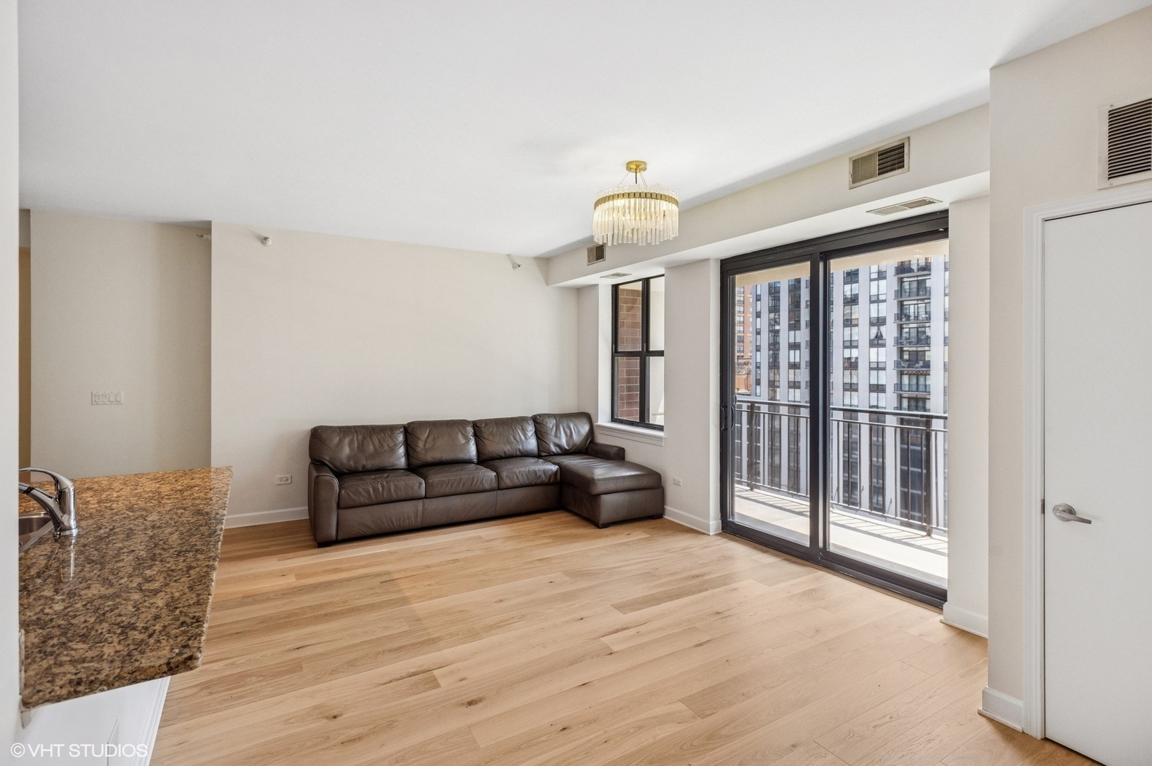 451 West Huron Street, Unit 910 Chicago, IL 60654 - Photo 20 of 27 a living room with furniture and a large window