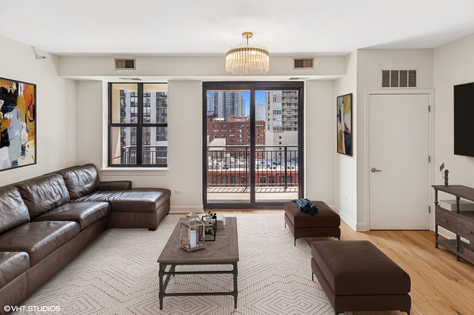 451 West Huron Street, Unit 910 Chicago, IL 60654 - Photo 2 of 27 a living room with furniture and a large window