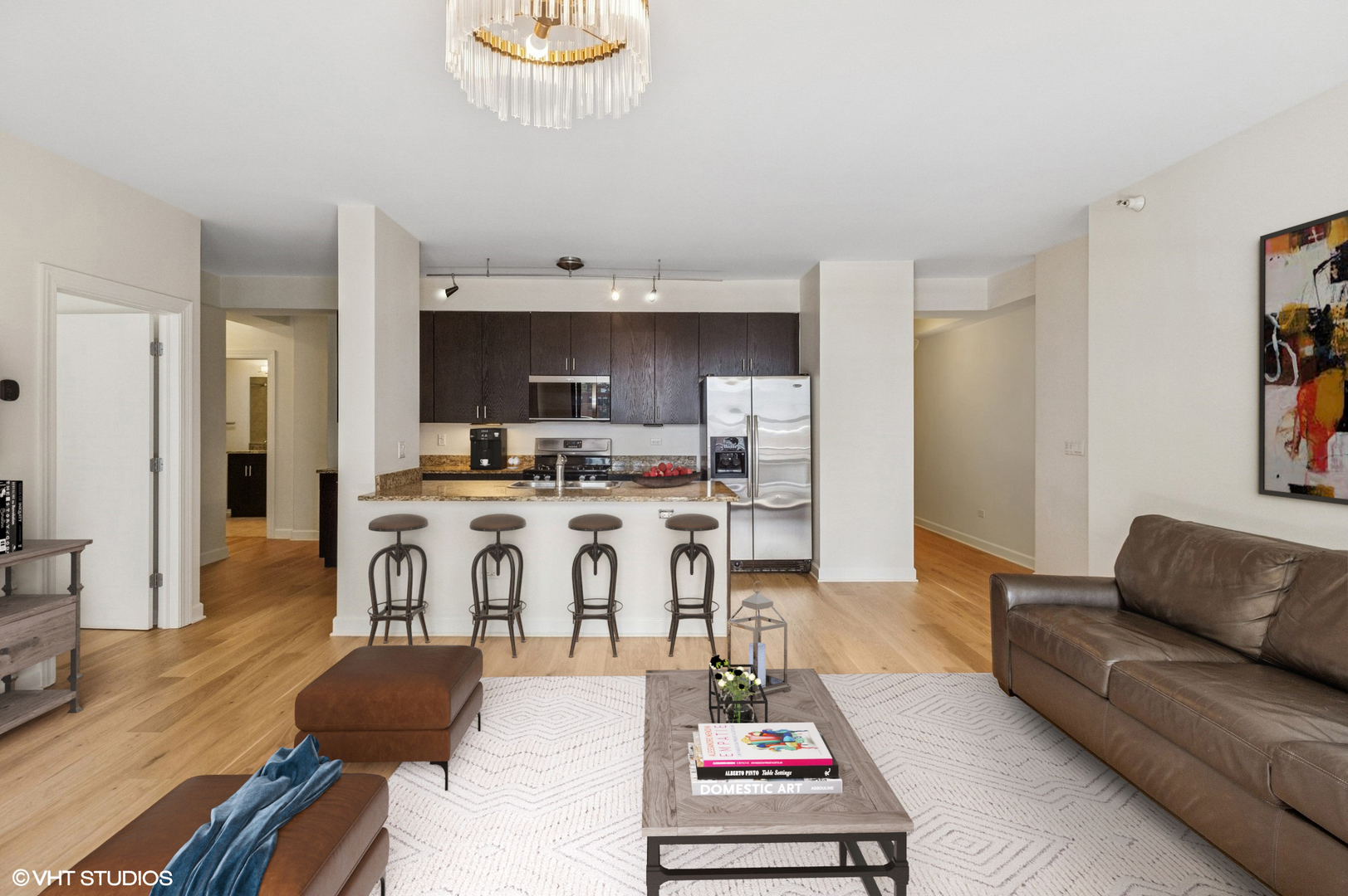 451 West Huron Street, Unit 910 Chicago, IL 60654 - Photo 3 of 27 a living room with furniture and kitchen view