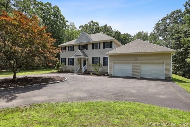 22 Country Way Bethel, CT 06801 - Photo 1 of 1 a front view of a house with a garden