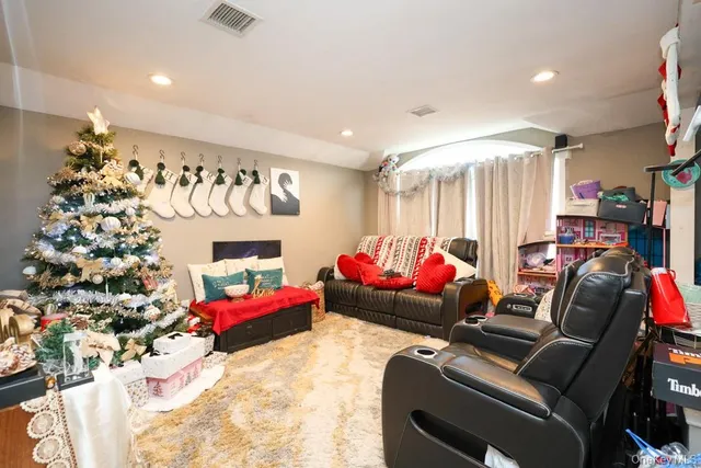 a bedroom with furniture and a chandelier