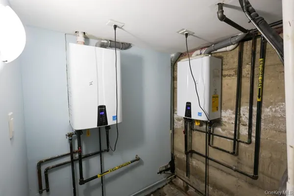 a view of a hallway with wooden floor and entryway