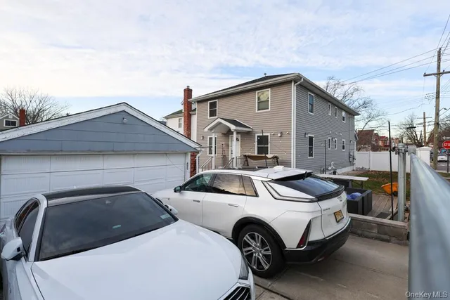 a view of a patio with couches table and chairs with wooden floor