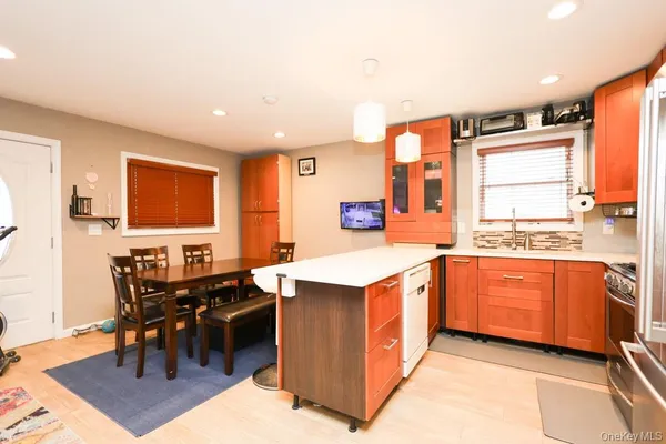 a kitchen with stainless steel appliances granite countertop a stove and a refrigerator