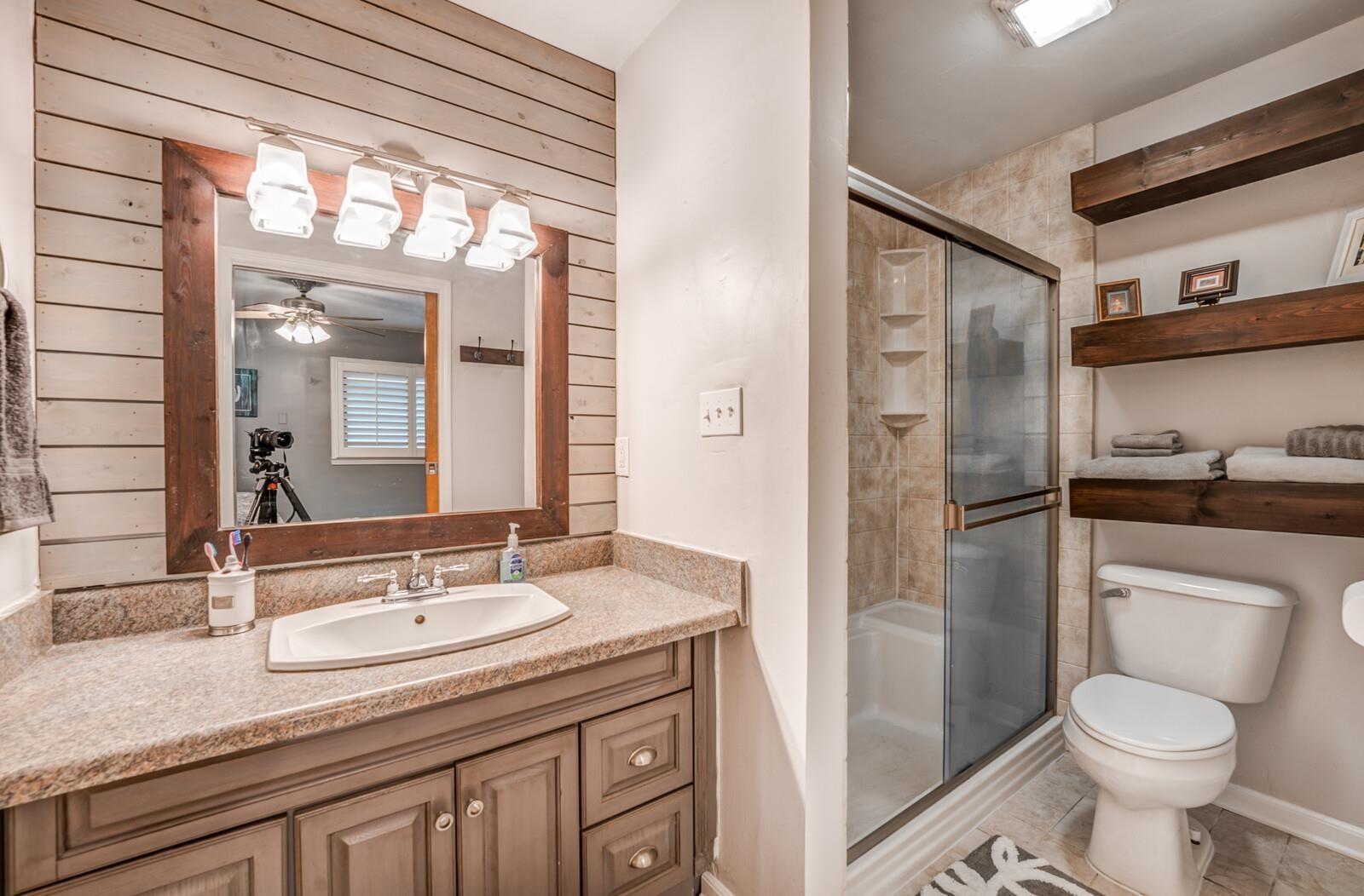 3089 Charles Bryan Road Bartlett, TN 38134 - Photo 15 of 28 a bathroom with a granite countertop sink toilet and shower