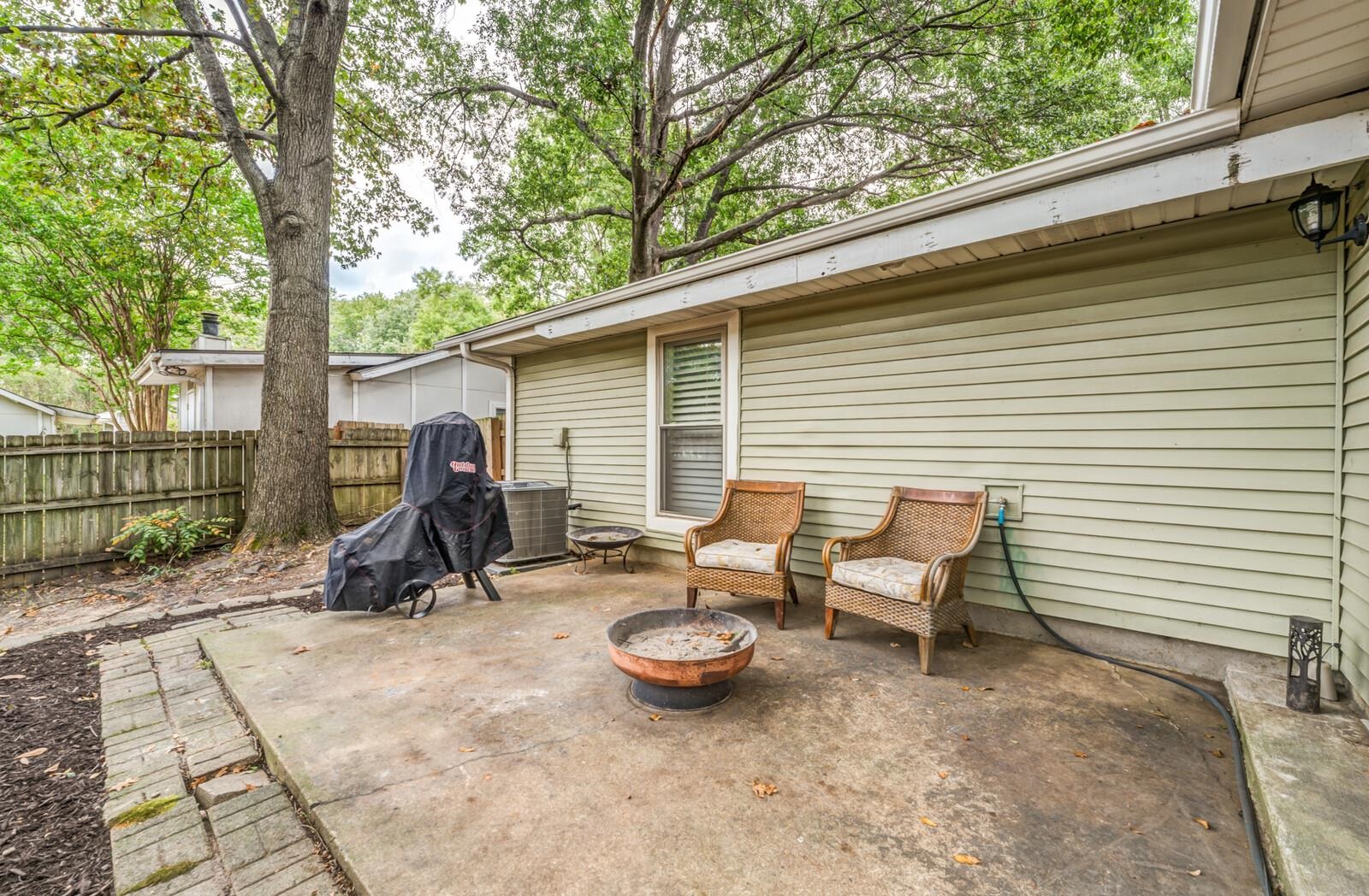 3089 Charles Bryan Road Bartlett, TN 38134 - Photo 27 of 28 a view of a backyard with a sitting area and furniture