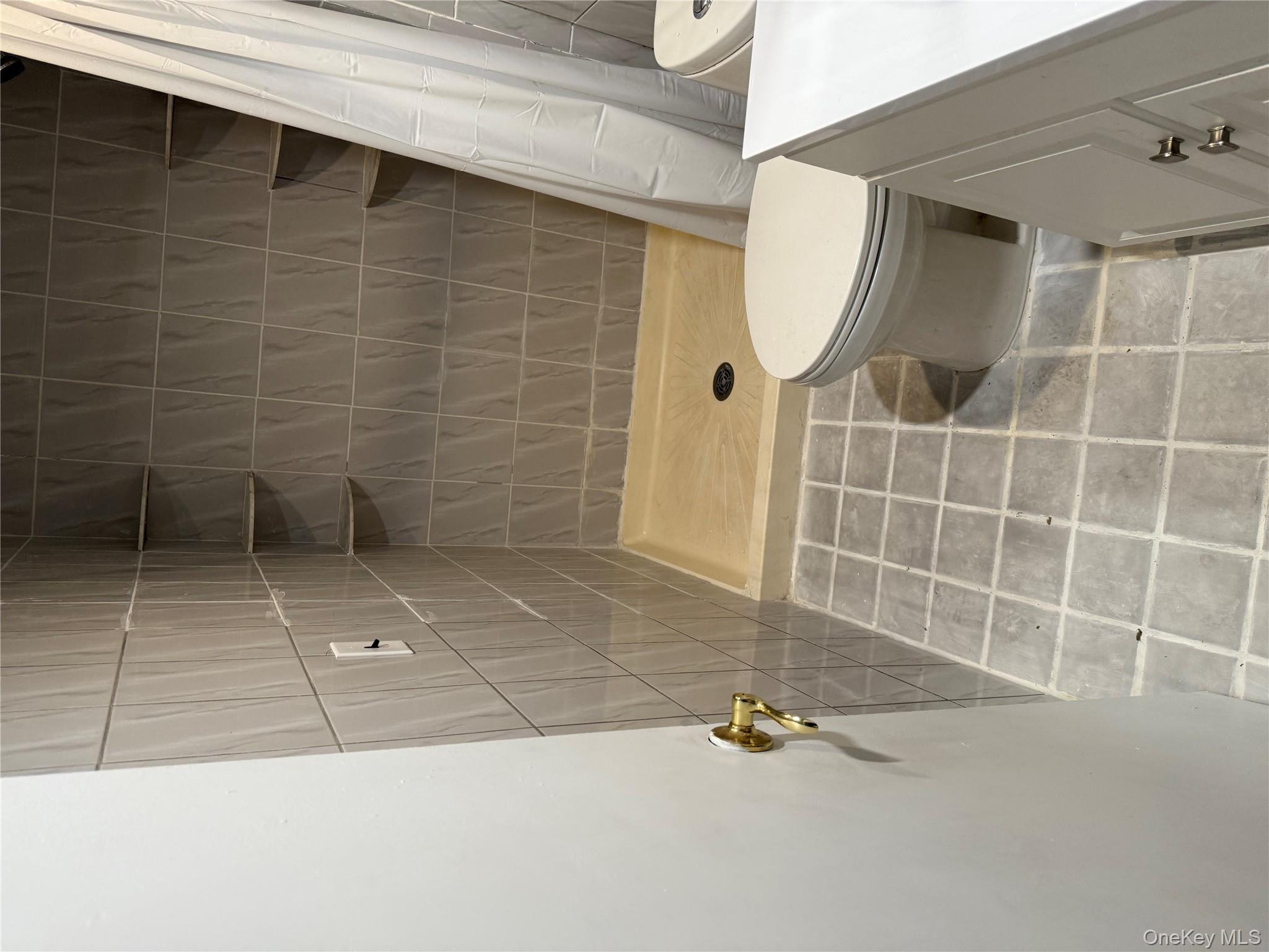 18 Leach Street Lynbrook, NY 11563 - Photo 11 of 17 a bathroom with a toilet and a shower