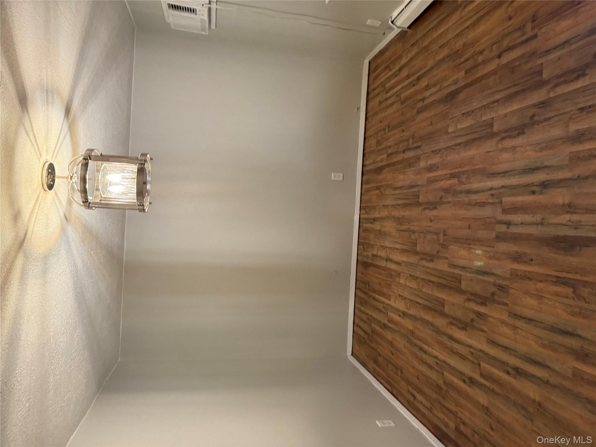 18 Leach Street Lynbrook, NY 11563 - Photo 17 of 17 a view of empty room with wooden floor