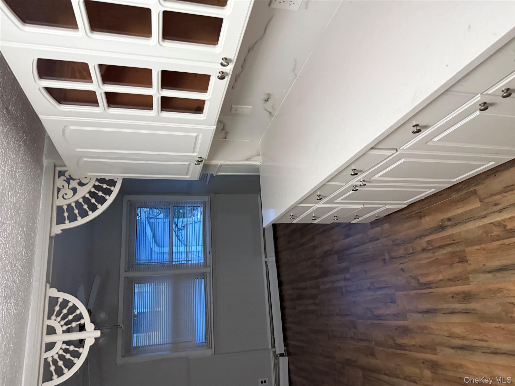 18 Leach Street Lynbrook, NY 11563 - Photo 4 of 17 a view of an entryway with wooden floor
