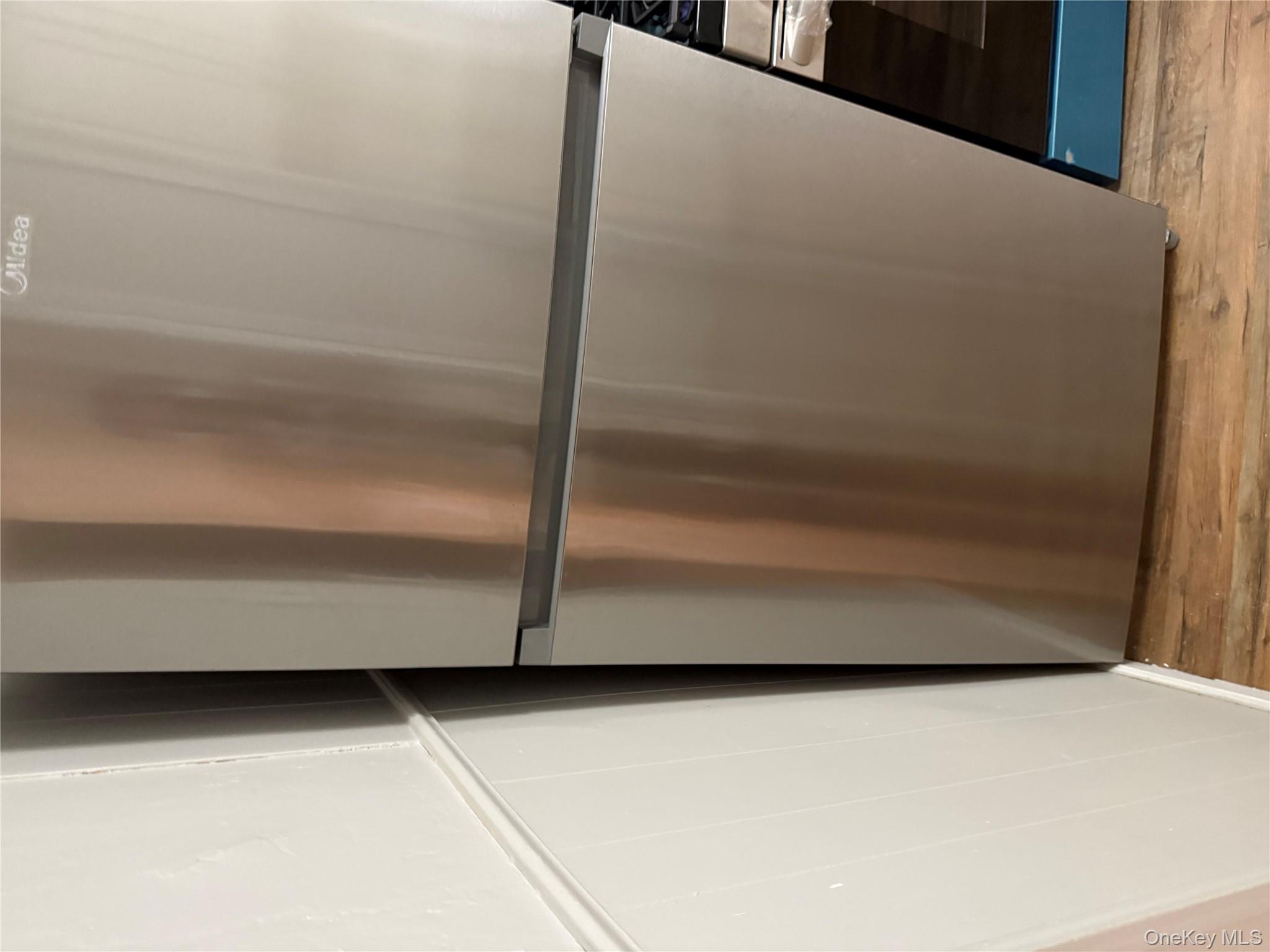 18 Leach Street Lynbrook, NY 11563 - Photo 6 of 17 a view of walk in closet with wooden floor