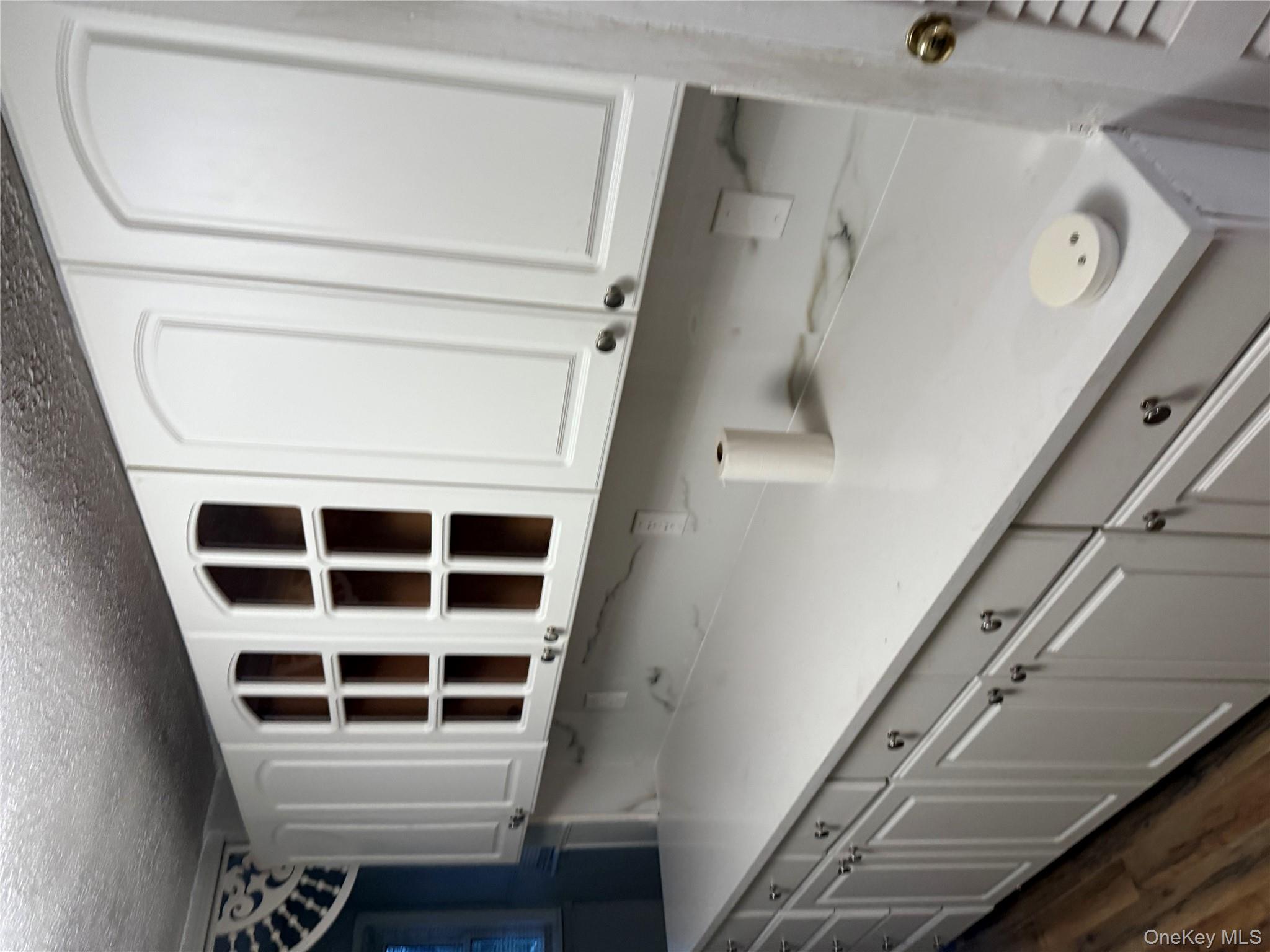 18 Leach Street Lynbrook, NY 11563 - Photo 8 of 17 a kitchen with a sink and cabinets