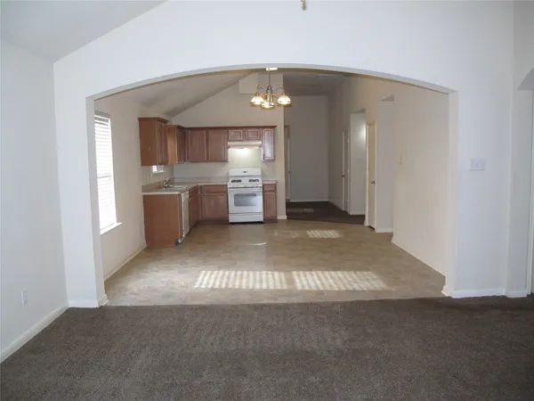 a kitchen with cabinets a sink and stainless steel appliances