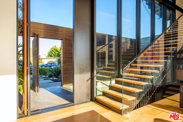 a view of balcony with wooden floor and glass door