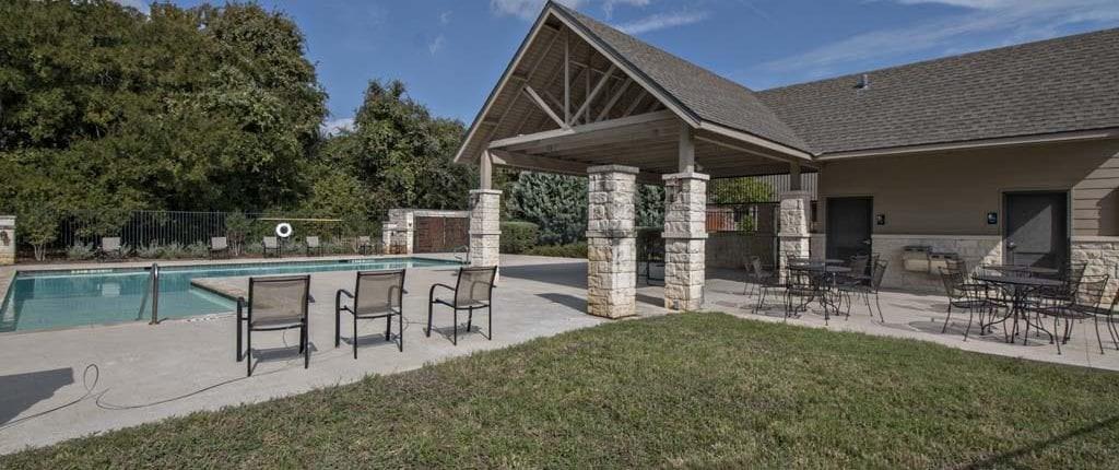 1141 Renaissance Trail Round Rock, TX 78665 - Photo 21 of 23 An inviting community pool with covered seating and recreational amenities awaits.