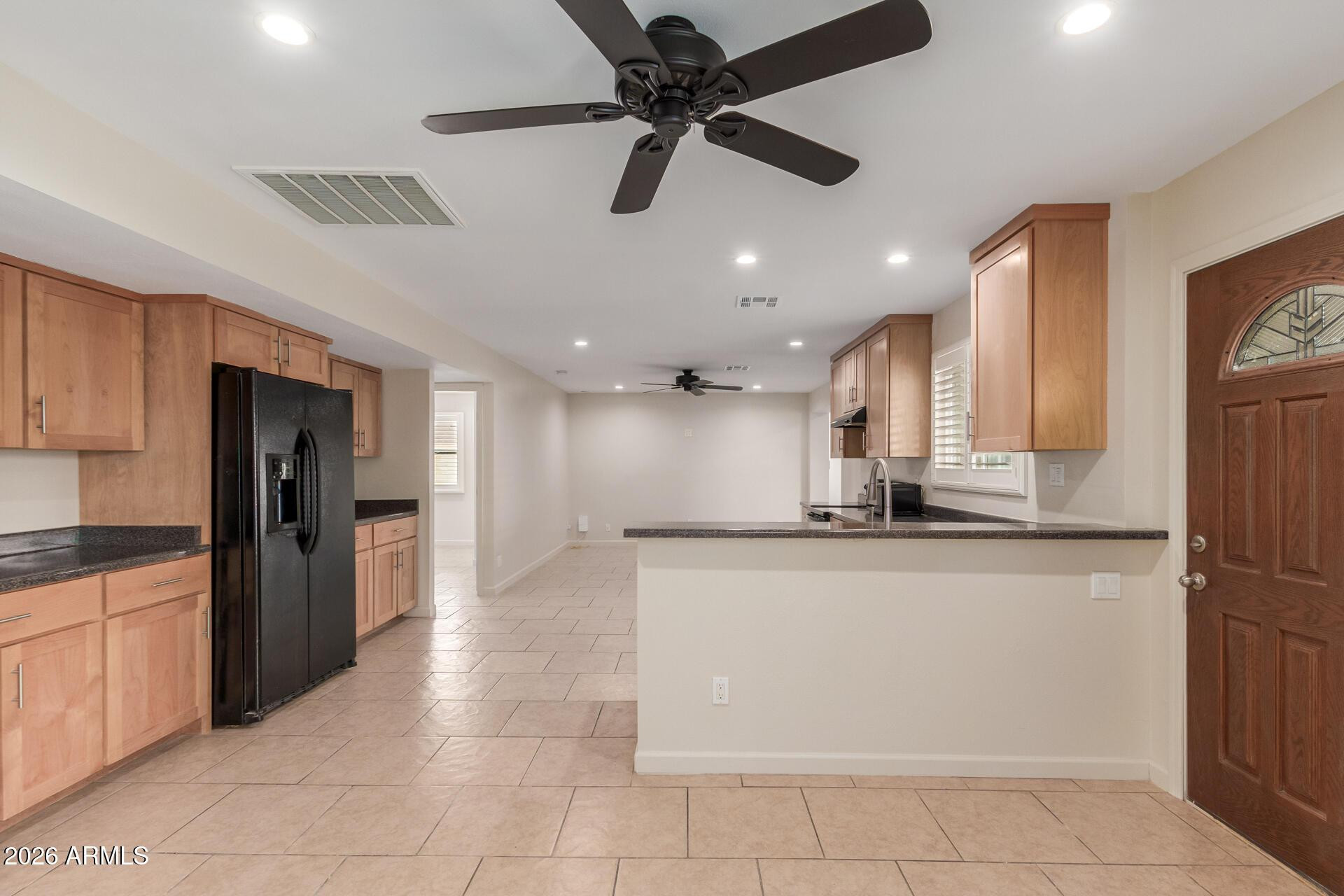 1628 East Del Rio Drive Tempe, AZ 85282 - Photo 4 of 32 a large kitchen with stainless steel appliances granite countertop a refrigerator and a sink