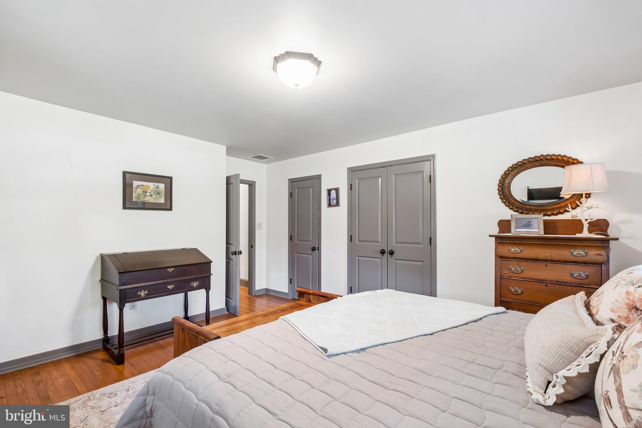 713 Alene Road Ambler, PA 19002 - Photo 18 of 40 a bedroom with a bed and a dresser
