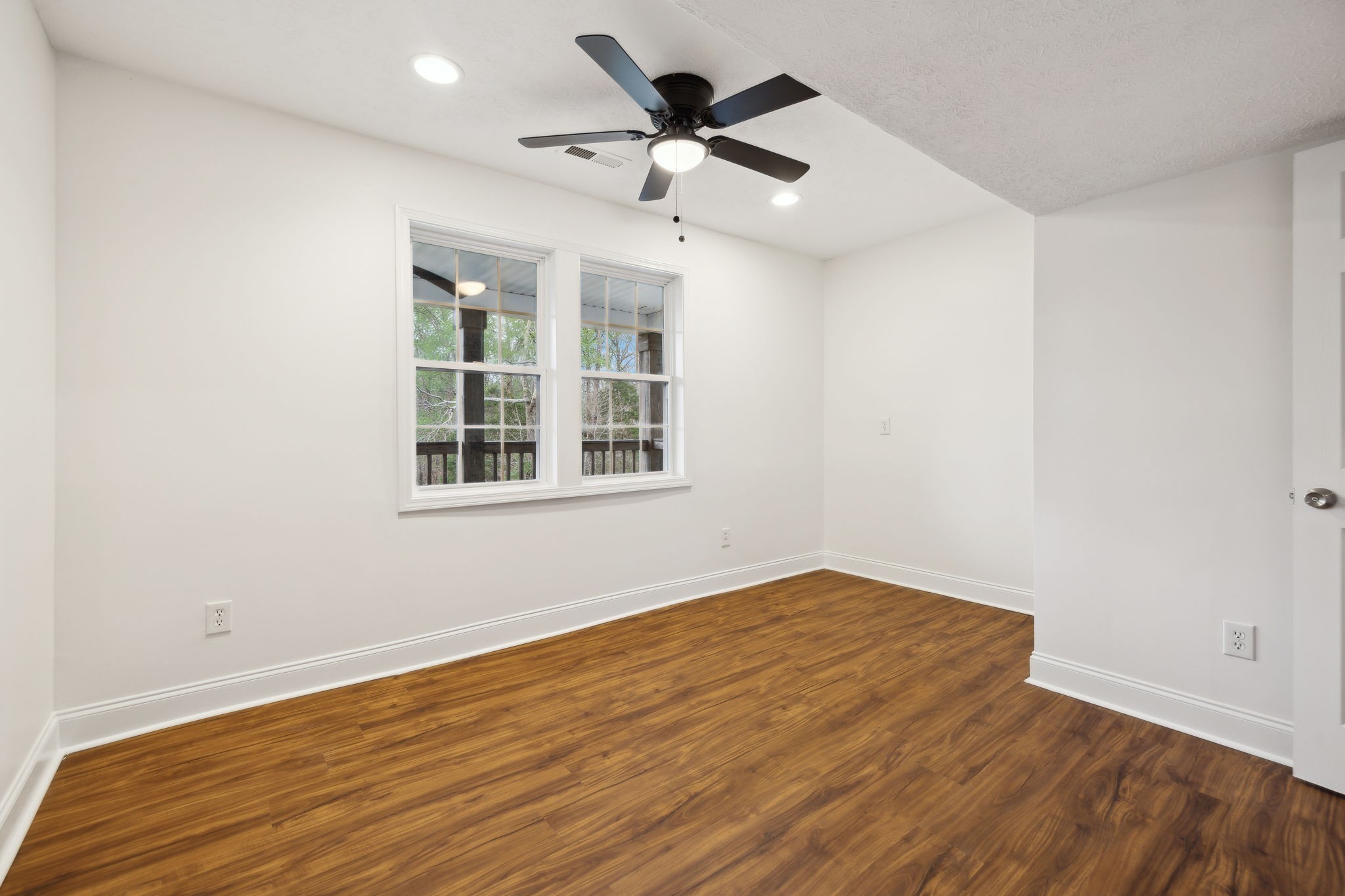 1054 Coker Ford Road Portland, TN 37148 - Photo 32 of 72 wooden floor in an empty room with a window