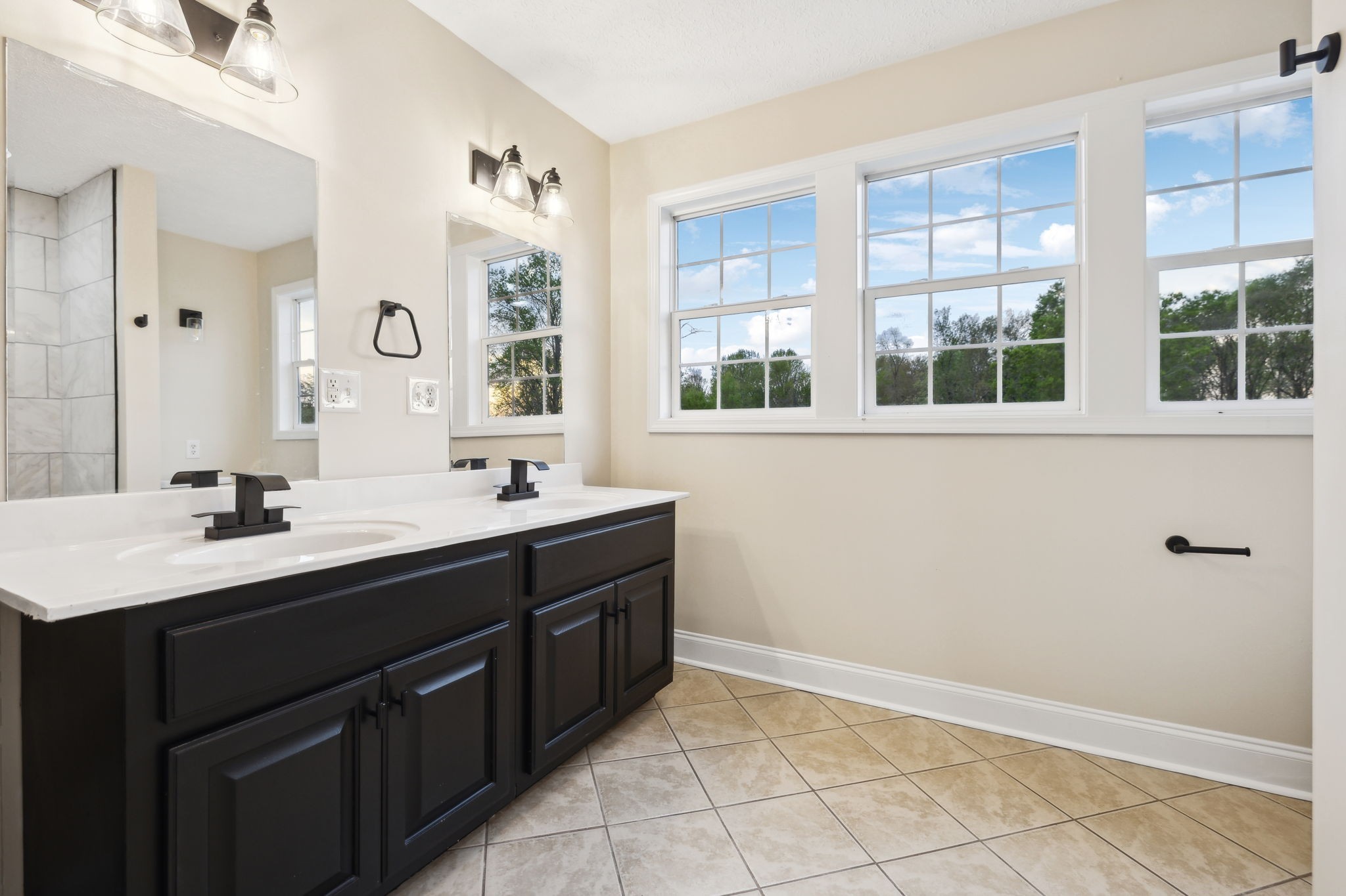 1054 Coker Ford Road Portland, TN 37148 - Photo 36 of 72 a bathroom with a sink double vanity and a mirror