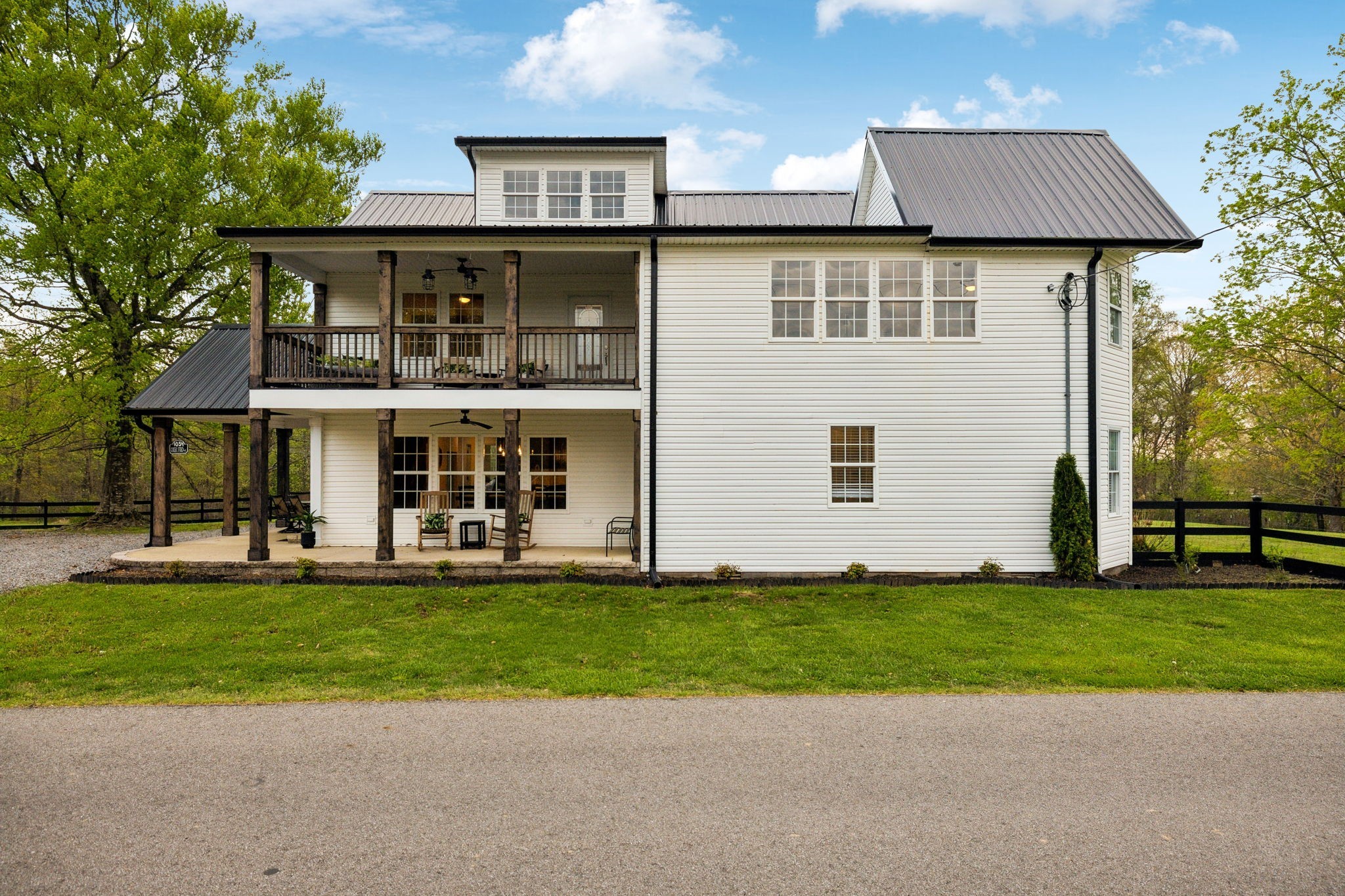 1054 Coker Ford Road Portland, TN 37148 - Photo 4 of 72 a front view of a house with a garden and yard