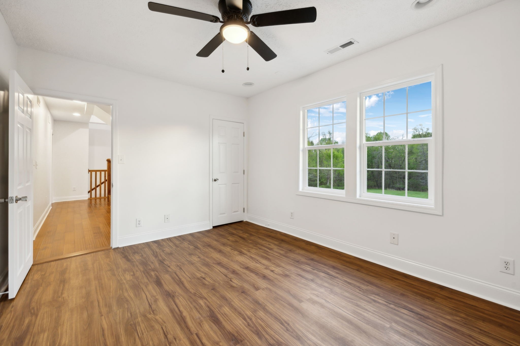 1054 Coker Ford Road Portland, TN 37148 - Photo 44 of 72 wooden floor in an empty room with a window