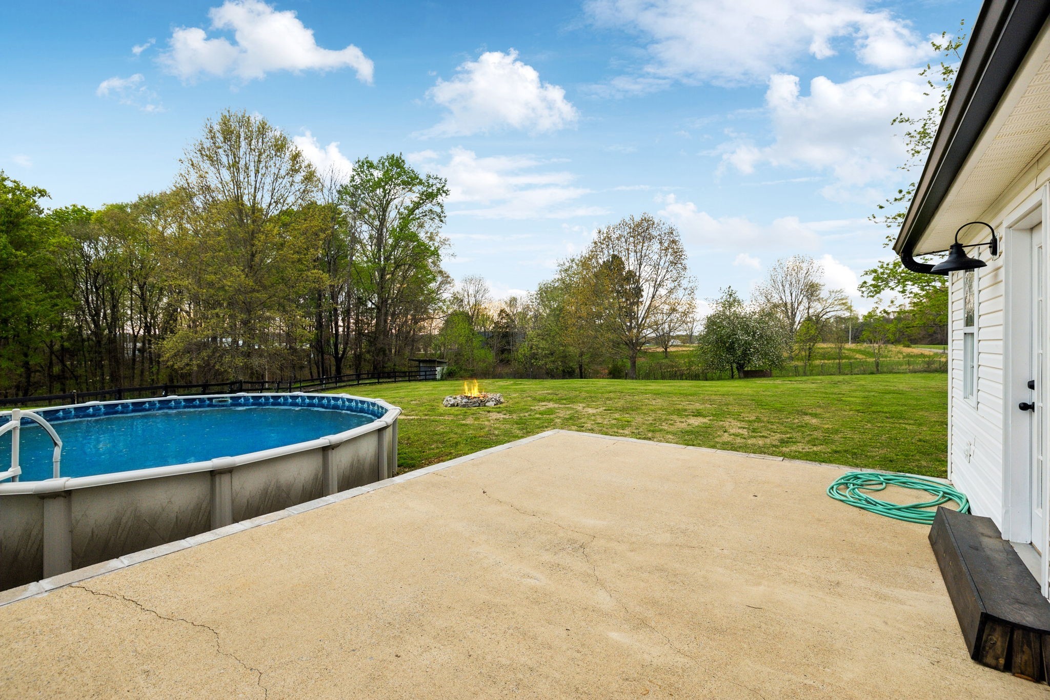1054 Coker Ford Road Portland, TN 37148 - Photo 49 of 72 a view of a swimming pool with a yard