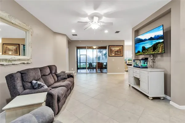 a kitchen with stainless steel appliances a refrigerator sink and microwave