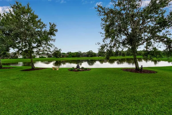 a view of a golf course with a lake