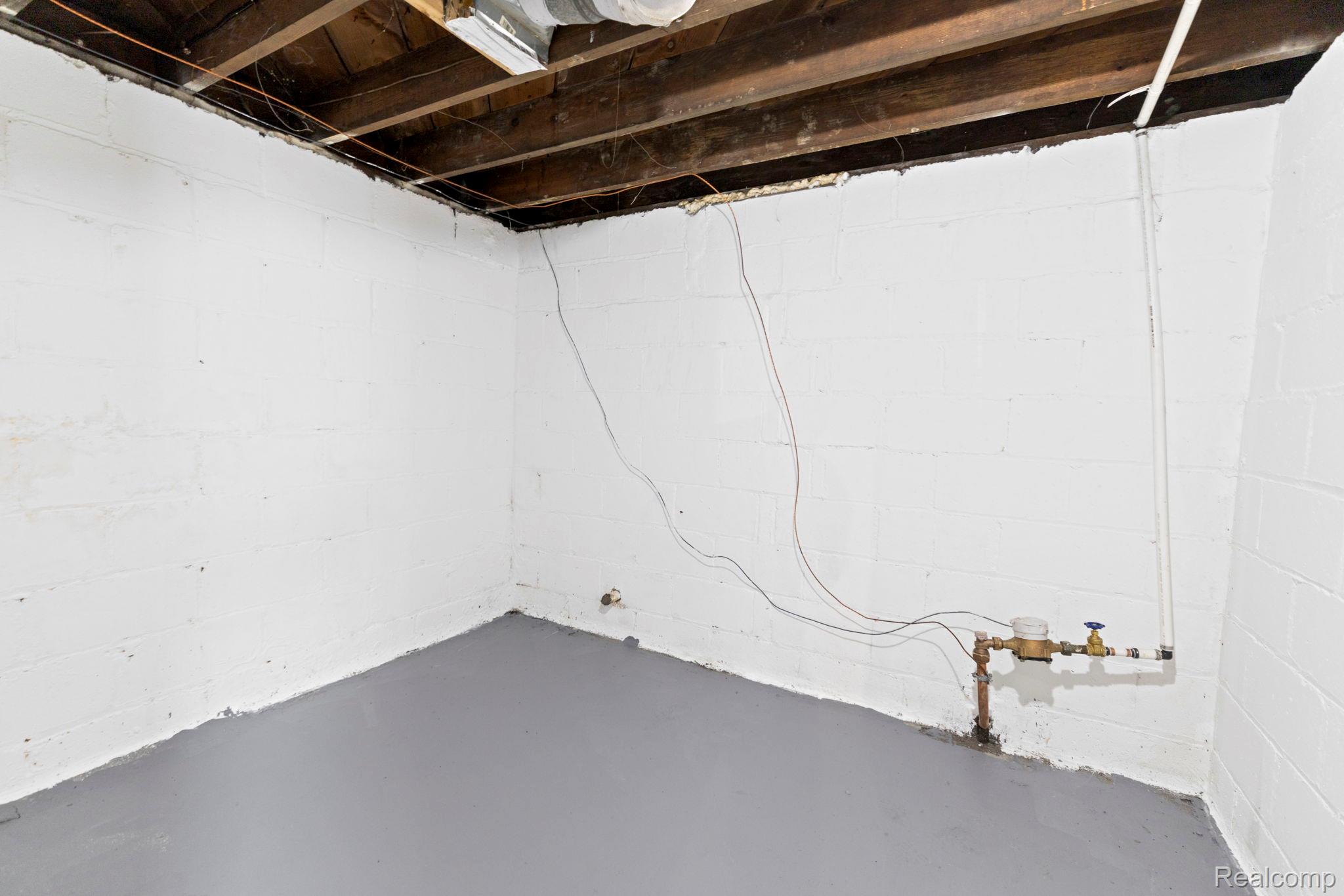 74 Pine Street River Rouge, MI 48218 - Photo 21 of 28 Unfinished basement with a water meter