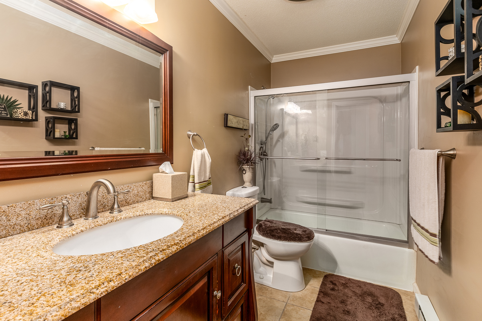 14798 Cherry Street Sesser, IL 62884 - Photo 14 of 37 a bathroom with a granite countertop sink toilet and shower