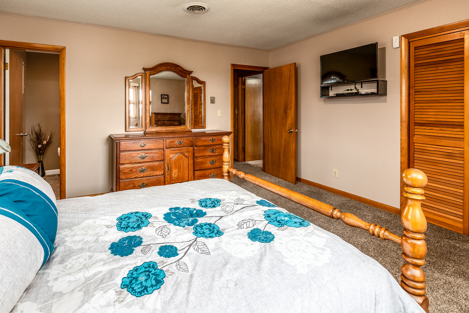 14798 Cherry Street Sesser, IL 62884 - Photo 15 of 37 a bedroom with a bed and a flat screen tv