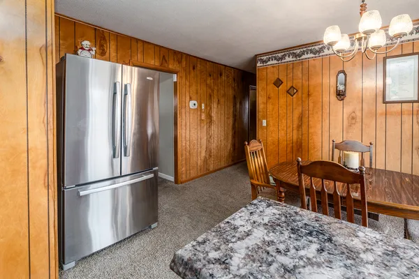 a view of a livingroom with furniture and front door