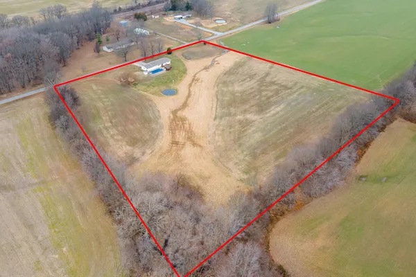 a house view with swimming pool in front of it