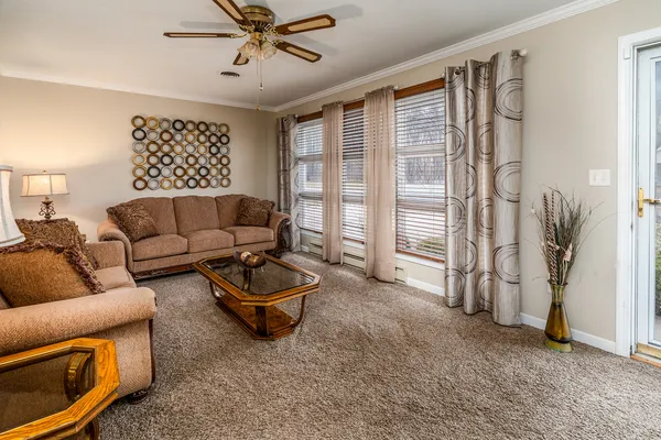 a living room with furniture and a window