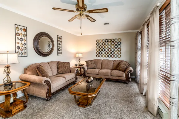 a living room with furniture and a large window