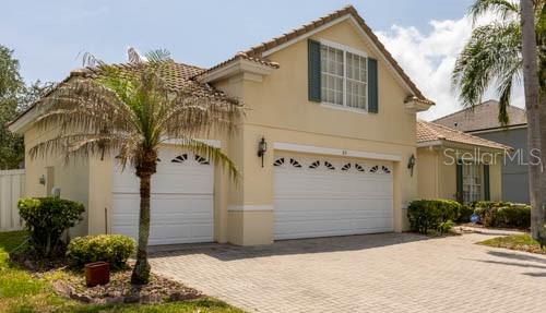 65 Calliope Street Ocoee, FL 34761 - Photo 3 of 60 a front view of a house with a yard