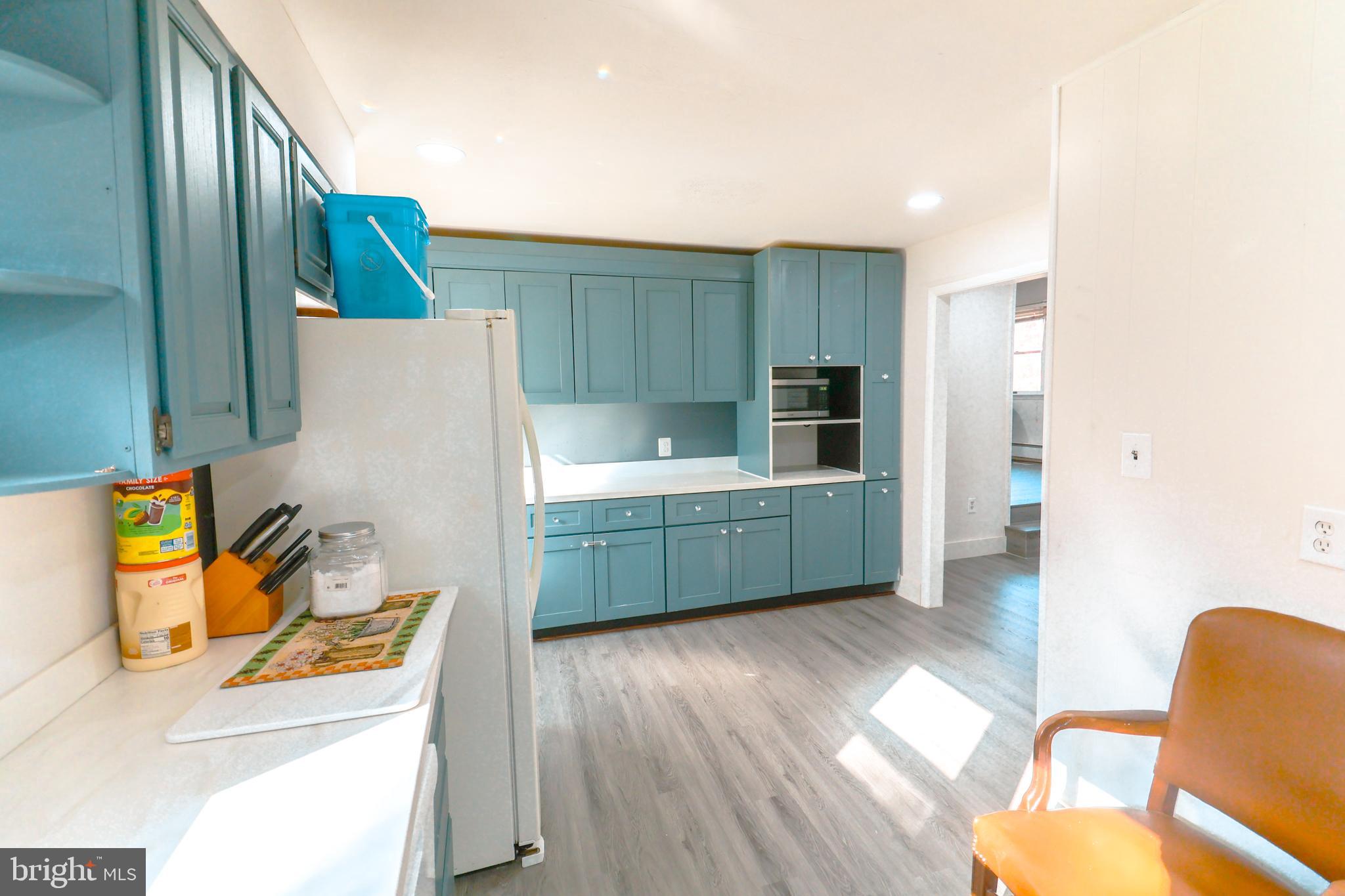 12704 Purcell Road Manassas, VA 20112 - Photo 14 of 47 a kitchen with a refrigerator and a sink