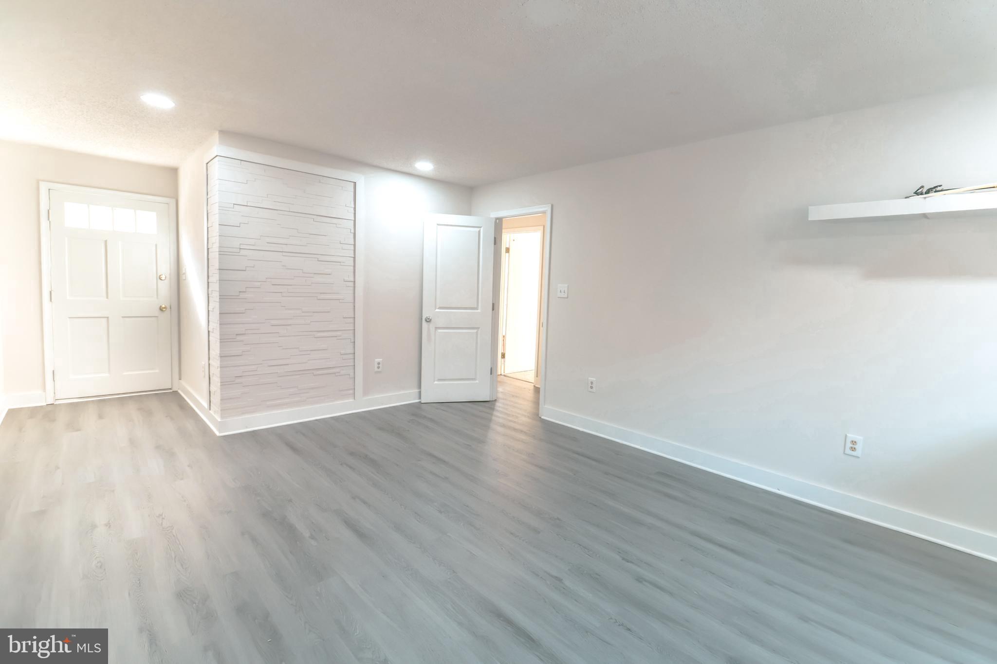 12704 Purcell Road Manassas, VA 20112 - Photo 17 of 47 a view of an empty room with wooden floor