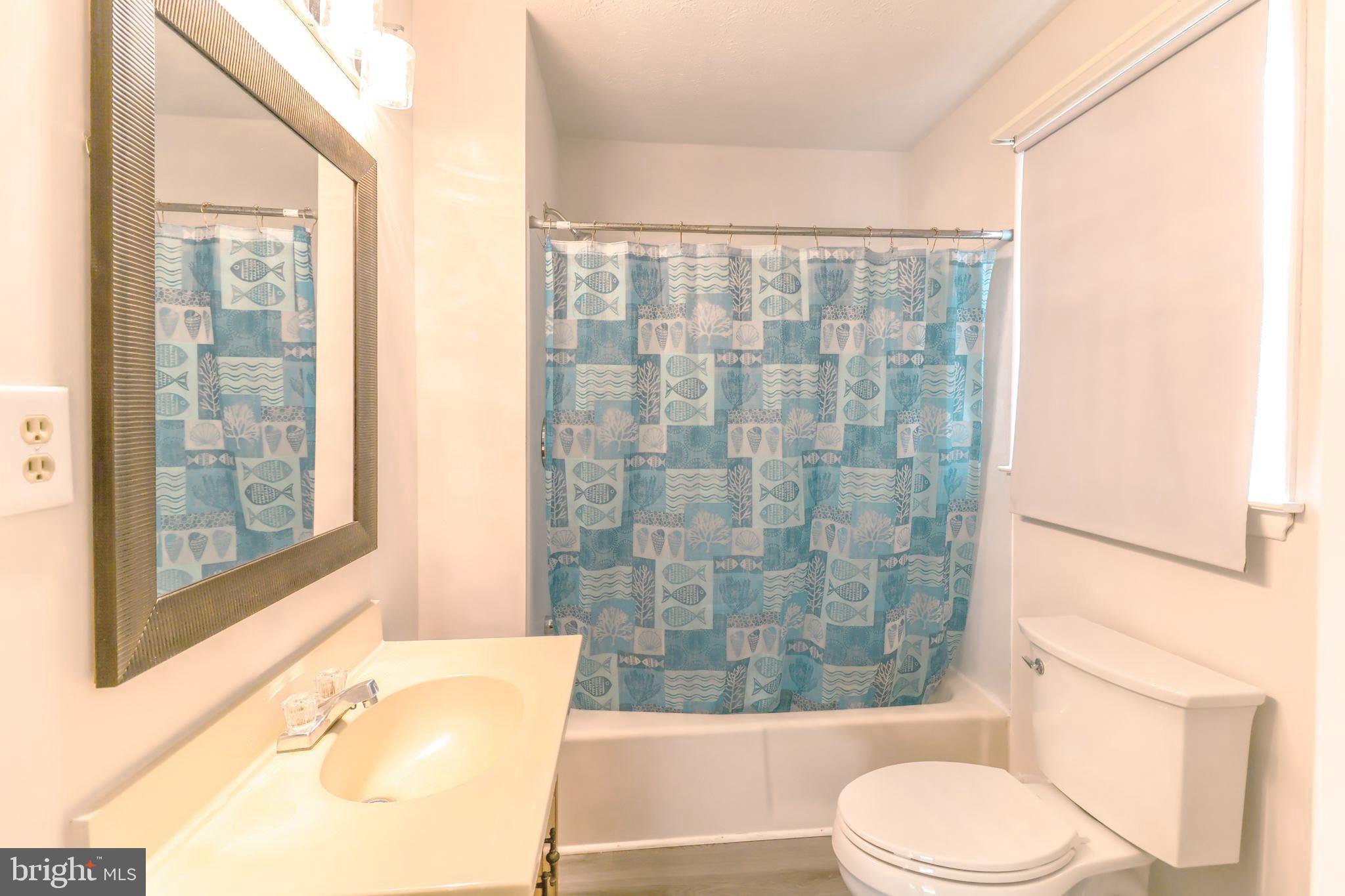 12704 Purcell Road Manassas, VA 20112 - Photo 18 of 47 a bathroom with a bathtub and shower