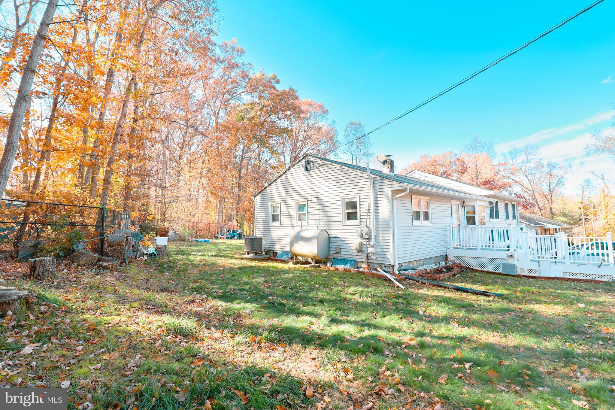 12704 Purcell Road Manassas, VA 20112 - Photo 33 of 47 a view of a white house with a big yard and large trees