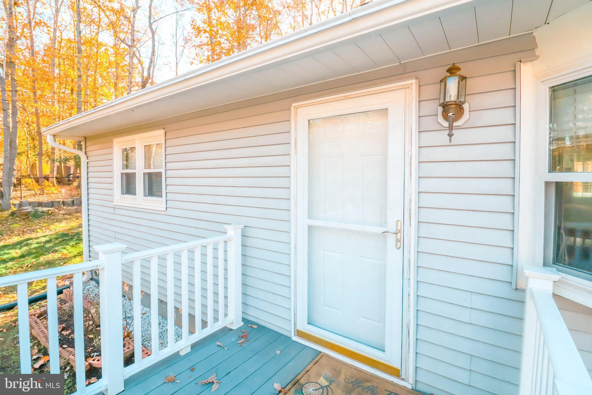 12704 Purcell Road Manassas, VA 20112 - Photo 40 of 47 a view of a porch with wooden floor