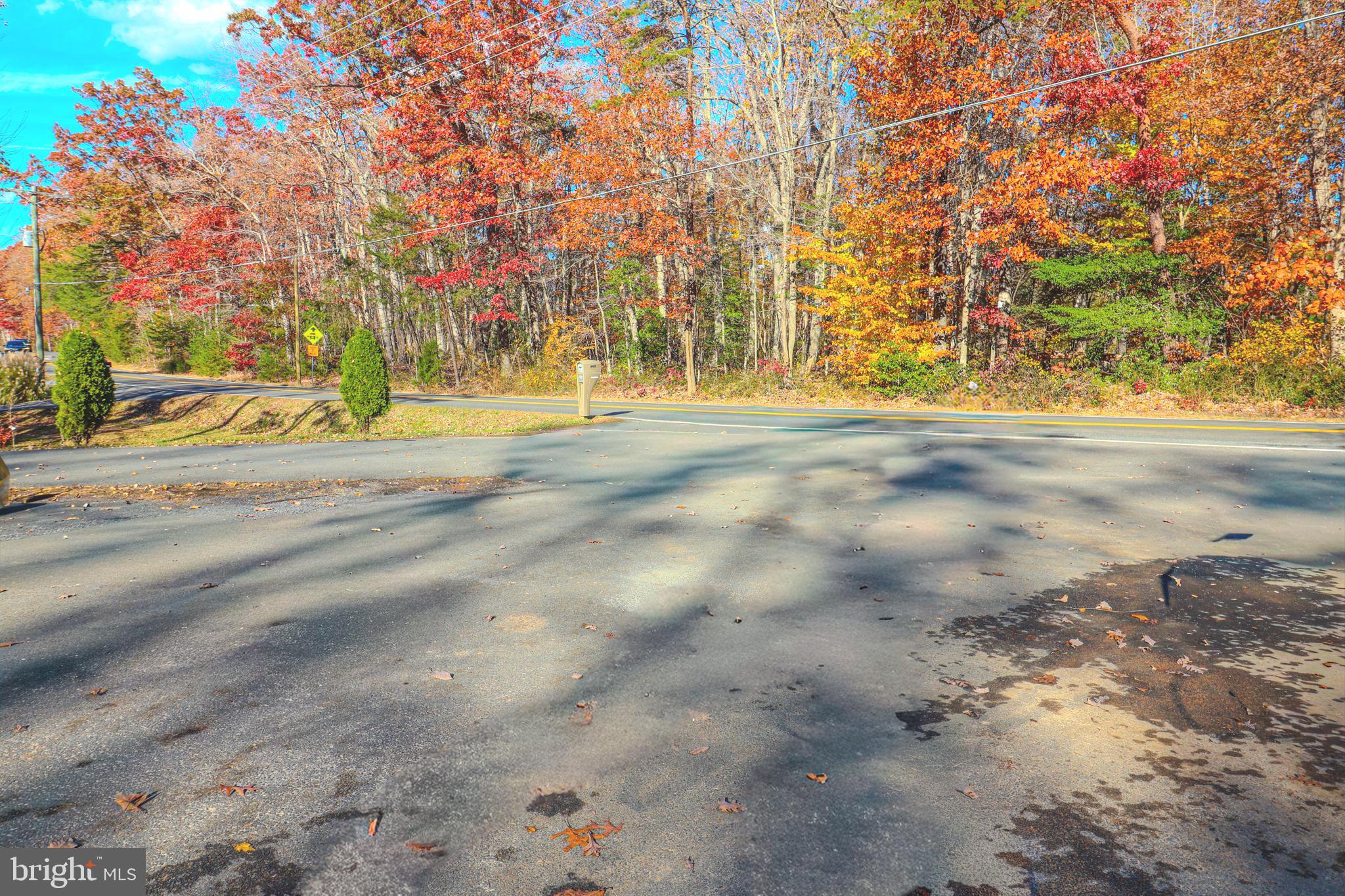 12704 Purcell Road Manassas, VA 20112 - Photo 41 of 47 a view of swimming pool with a yard and trees