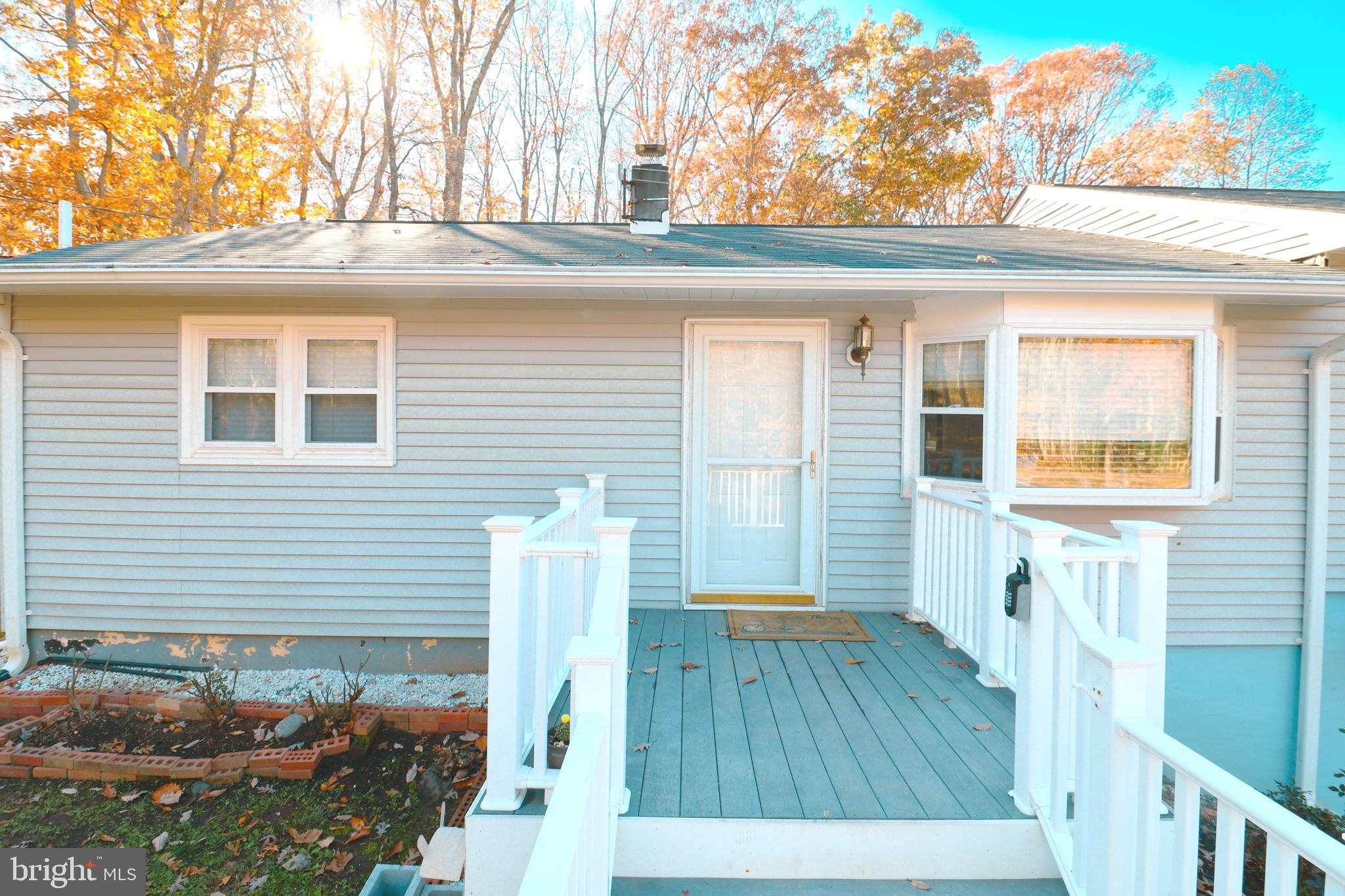 12704 Purcell Road Manassas, VA 20112 - Photo 8 of 47 view of house with wooden floor and outdoor seating