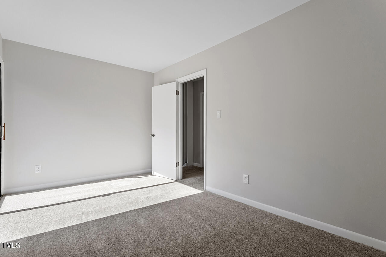 4100 Five Oaks Drive, Unit 46 Durham, NC 27707 - Photo 21 of 36 an empty room with an entryway