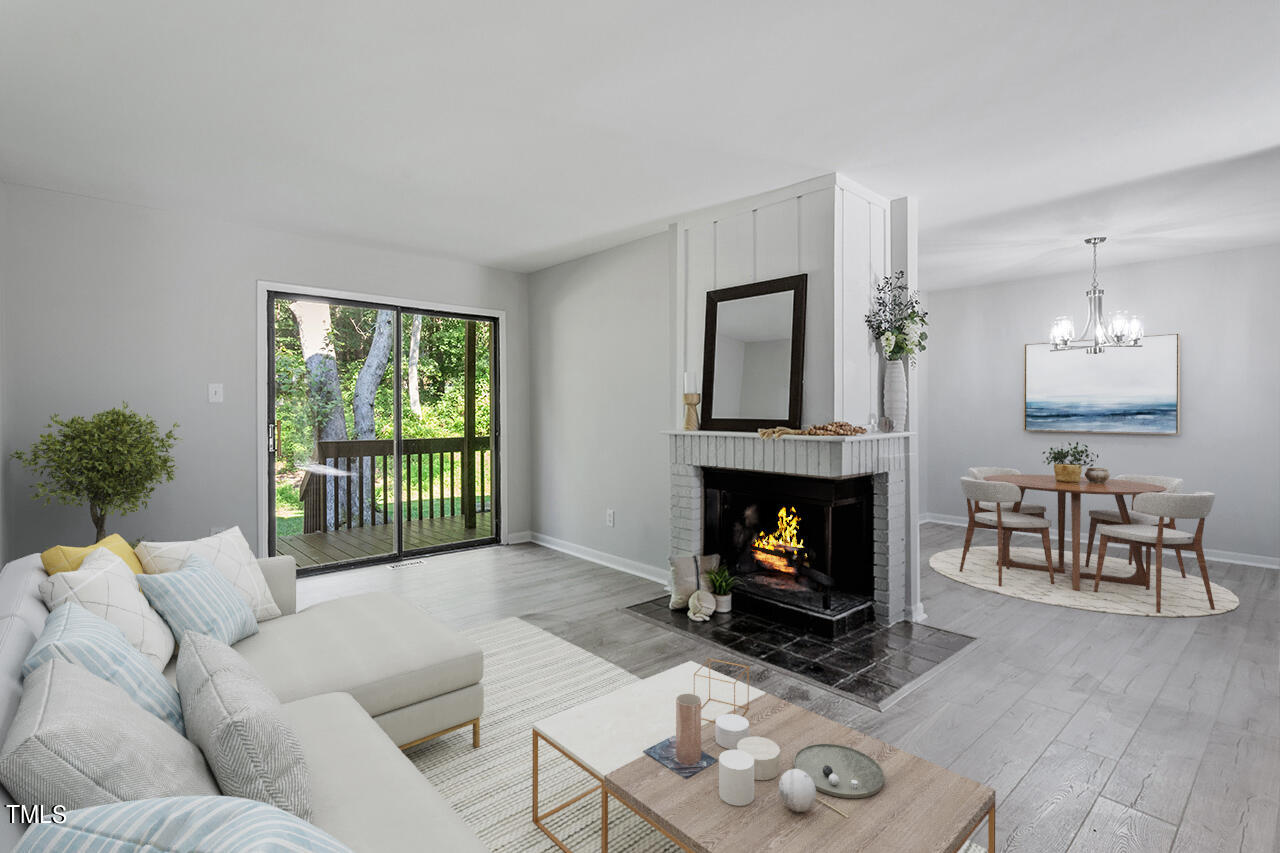 4100 Five Oaks Drive, Unit 46 Durham, NC 27707 - Photo 3 of 36 a living room with furniture and a fireplace