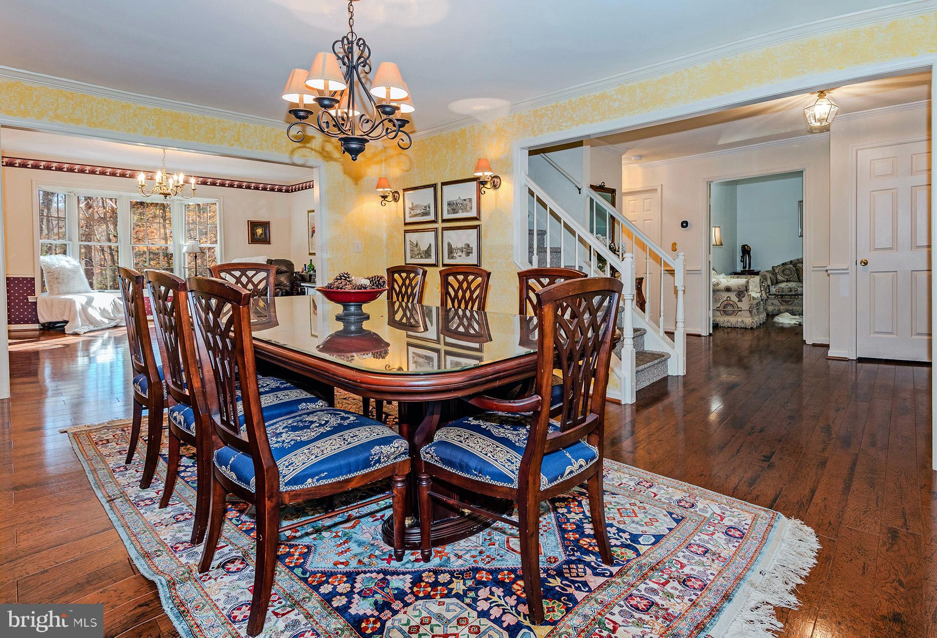 621 Wood Lot Trail Road Annapolis, MD 21401 - Photo 12 of 44 a view of a dining room with furniture and wooden floor