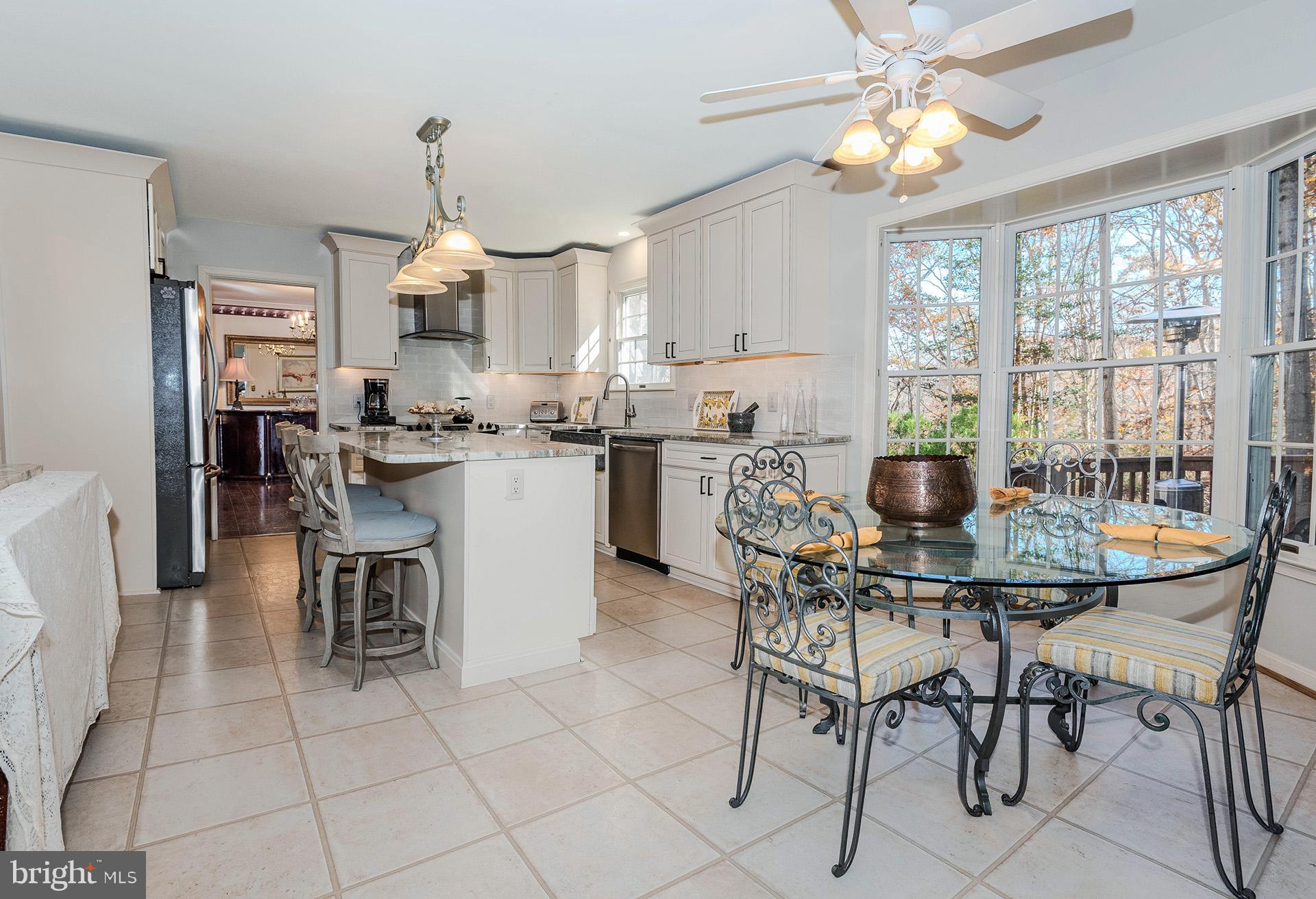 621 Wood Lot Trail Road Annapolis, MD 21401 - Photo 16 of 44 a view of a dining room with furniture and a chandelier